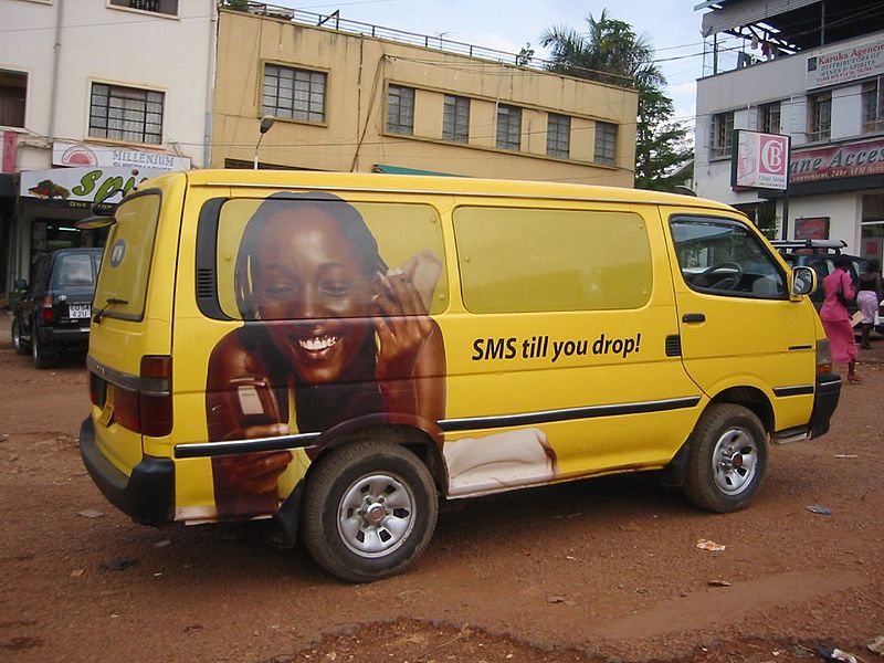 Telco ad on a van in Kampala, Uganda. Photo by futureatlas.com via Flickr (CC BY 2.0)